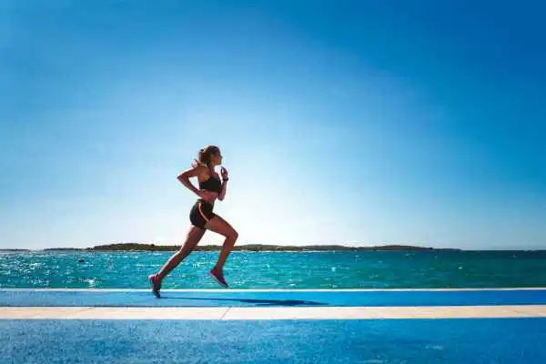 Woman running showing strong leg muscle West Bromwich